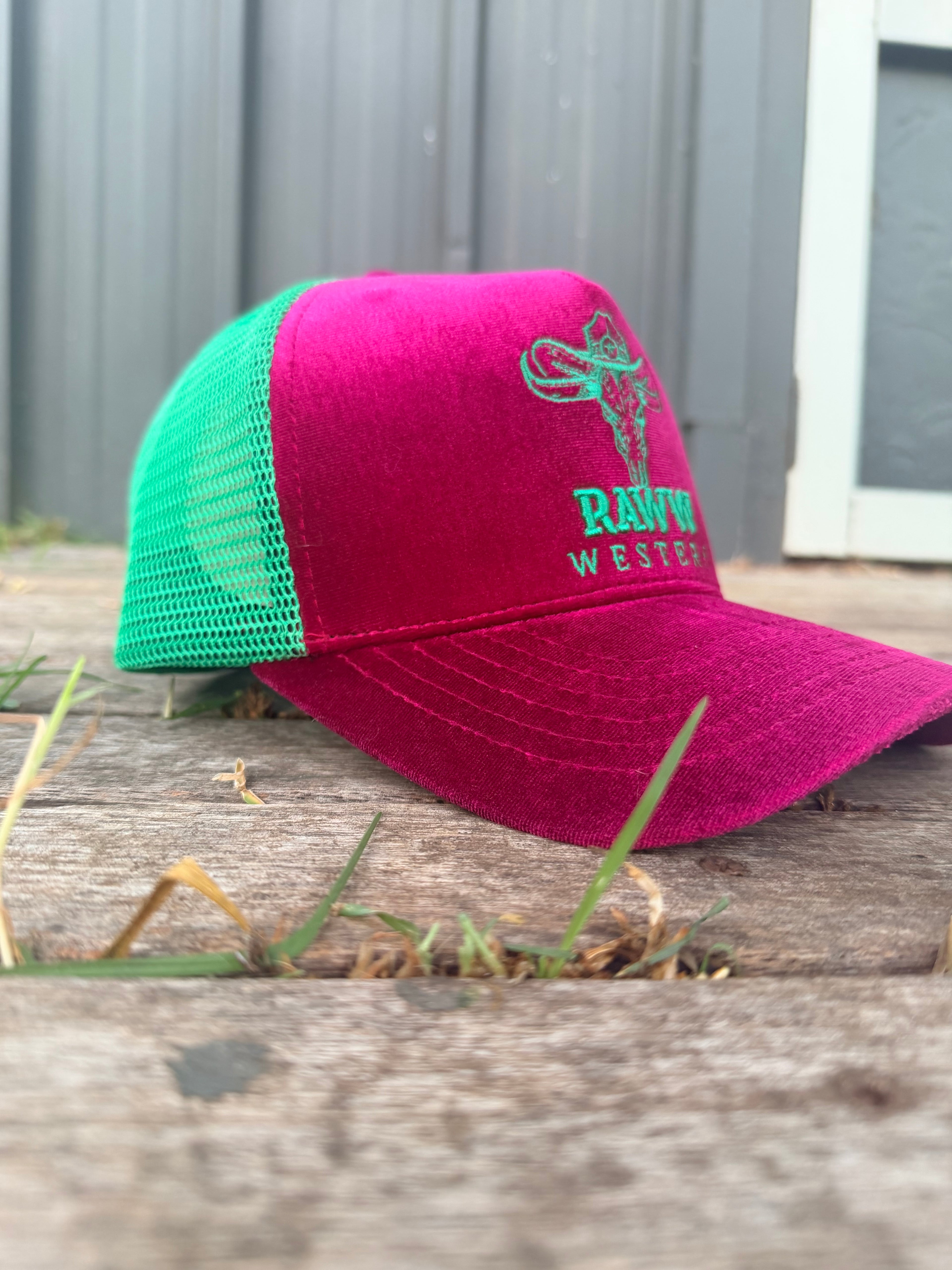 Ruby velvet trucker cap with green mesh back and embroidered RAW WES tern logo