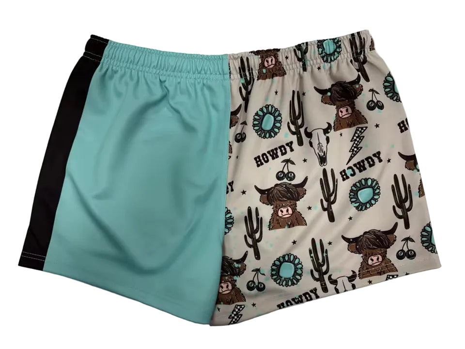 Footy shorts with teal side panel and white cowboy print front
