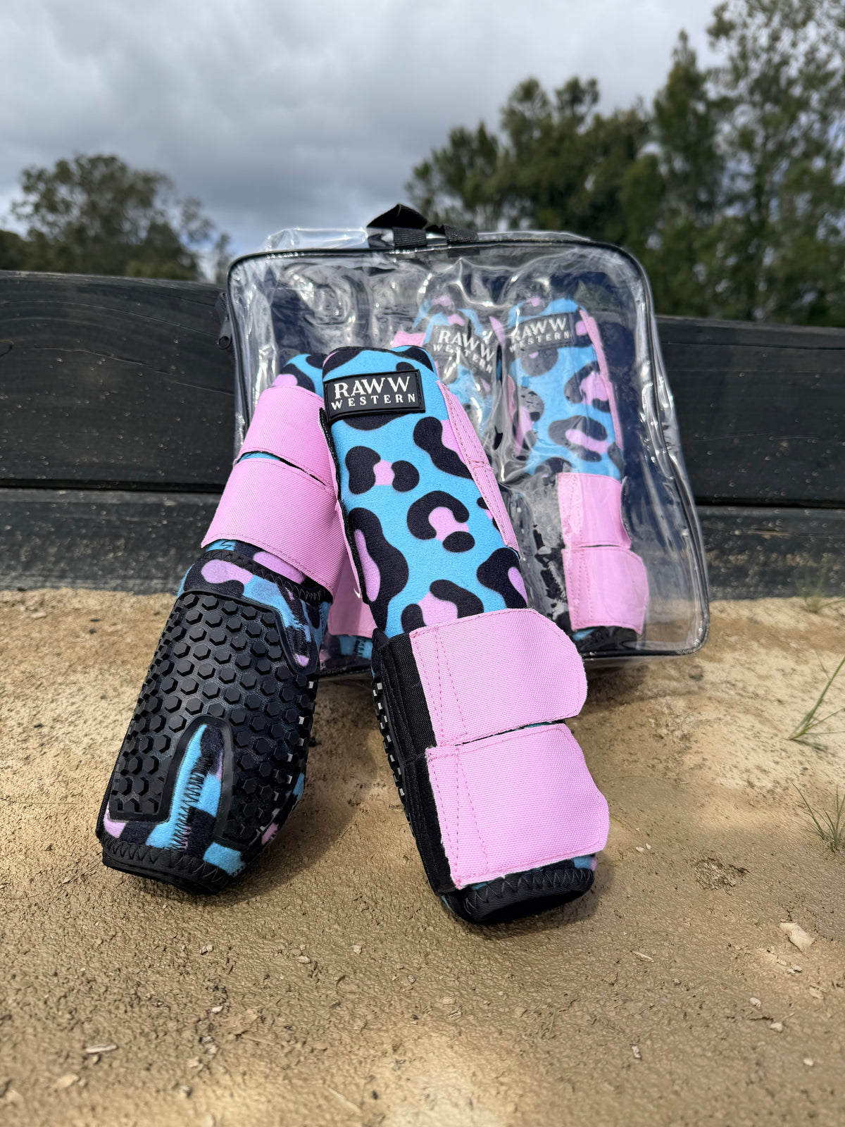 Leopard-print splint boots with pink and blue accents, black shell and hook strap detail