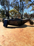 Black Western spurs with metal rowel and RAW WESTERN logo strap
